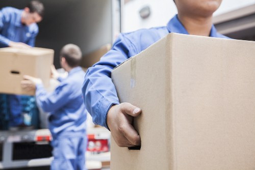 Team handling desks and equipment during an office move