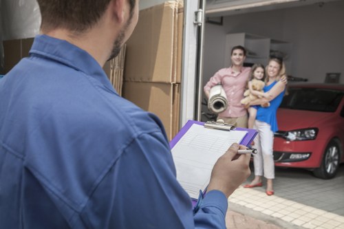 Professional movers packing boxes in a Shoreditch flat