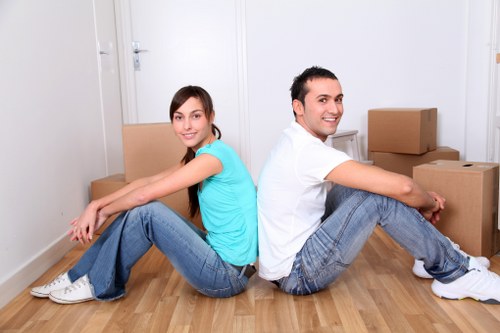 Prepared Shoreditch home move with boxes, wrapped furniture, and moving supplies